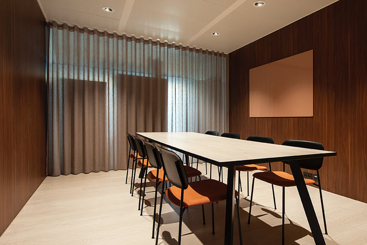 The Lorenzo walnut medium brown wall merges seamlessly into the lighter laminate floor